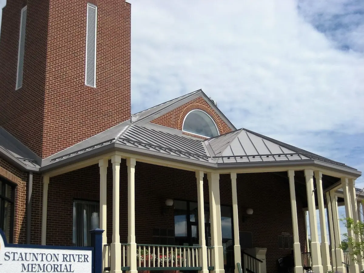 Skilled roofing craftsmen working on a residential roof in Manning